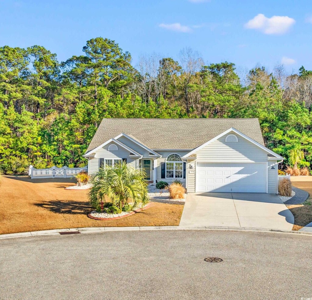 view of front of property featuring a garage