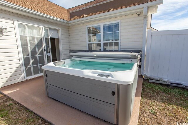 view of patio with a hot tub