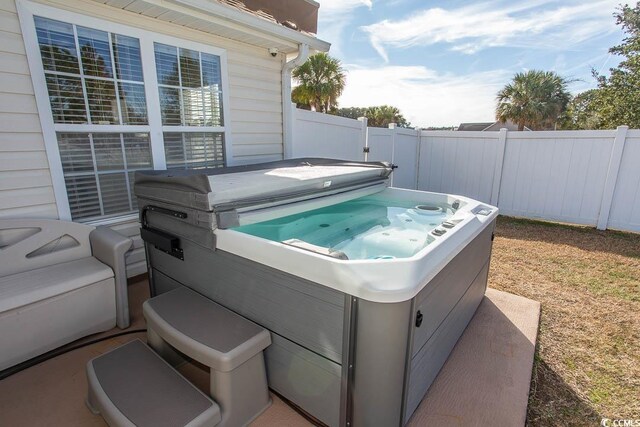 view of patio / terrace featuring a hot tub