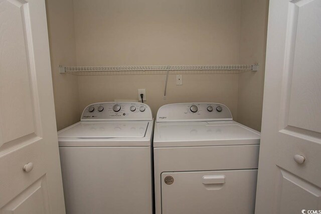 washroom with separate washer and dryer