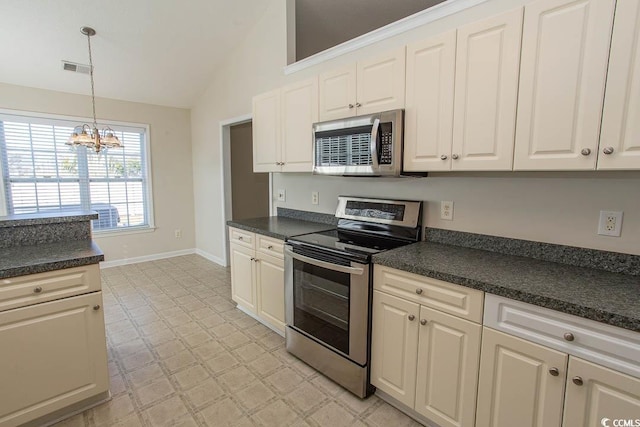 kitchen with decorative light fixtures, an inviting chandelier, appliances with stainless steel finishes, and vaulted ceiling