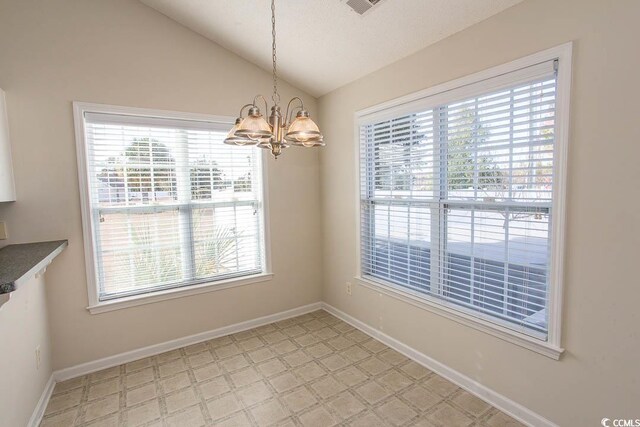 unfurnished dining area with lofted ceiling and a notable chandelier