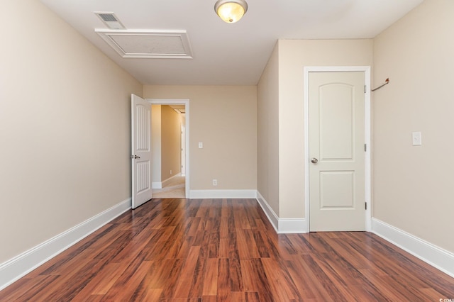 unfurnished bedroom with dark hardwood / wood-style flooring