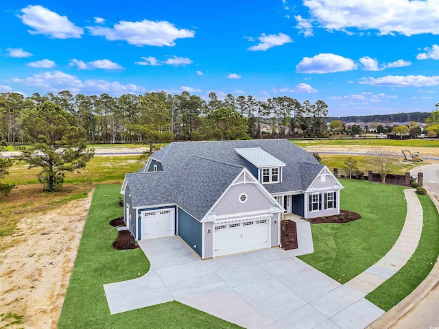 view of front facade with a garage and a front lawn