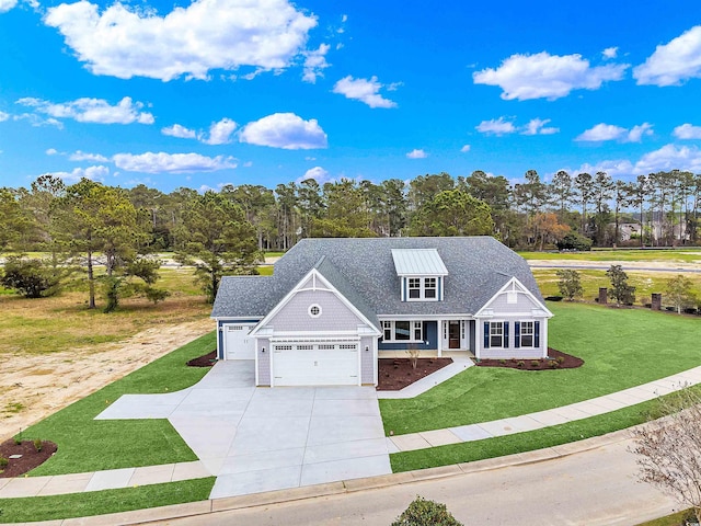 view of front of house with a front lawn, covered porch, and a garage