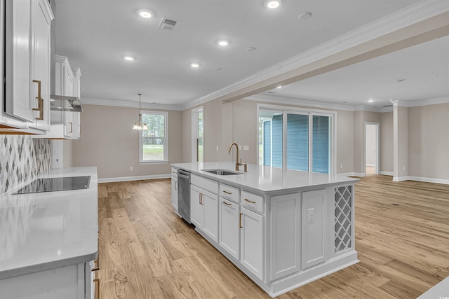 kitchen featuring a center island with sink, white cabinetry, sink, and light hardwood / wood-style flooring