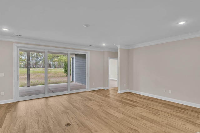 unfurnished room featuring light hardwood / wood-style floors and ornamental molding