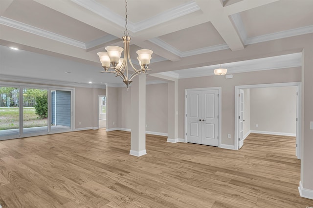 empty room with beam ceiling, plenty of natural light, coffered ceiling, and light wood-type flooring