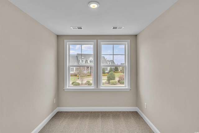 unfurnished room with carpet floors