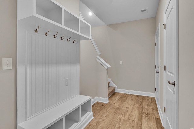 mudroom with light hardwood / wood-style floors