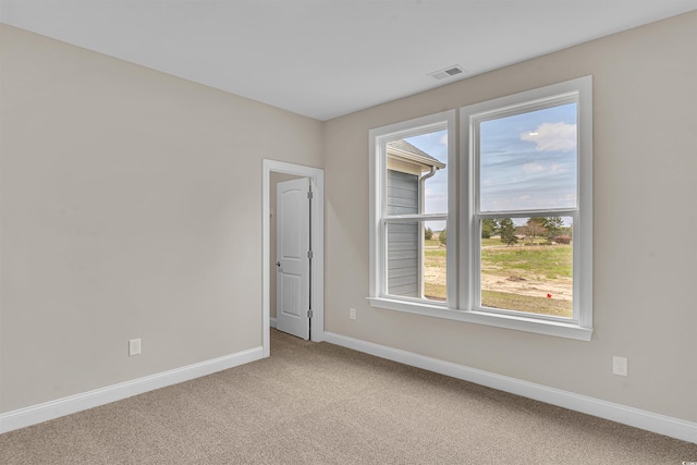 unfurnished room featuring carpet flooring