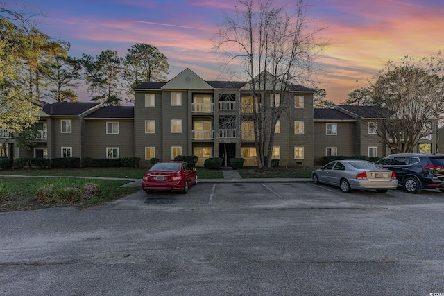 view of outdoor building at dusk