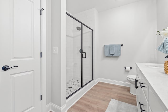 852 Comanders Island Rd, Georgetown, SC 29440 - bathroom featuring a stall shower, vanity, baseboards, toilet, and wood finished floors