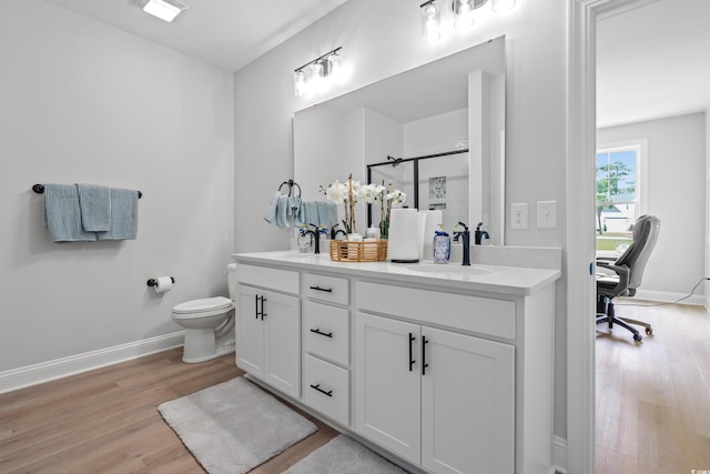 852 Comanders Island Rd, Georgetown, SC 29440 - full bath featuring wood finished floors, double vanity, a shower stall, and toilet