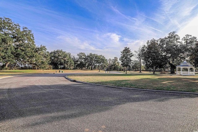 852 Comanders Island Rd, Georgetown, SC 29440 - view of road with curbs and view of wooded area