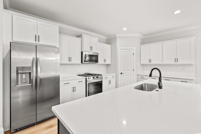 805 Comanders Island Rd, Georgetown, SC 29440 - kitchen featuring appliances with stainless steel finishes, a sink, crown molding, recessed lighting, and white cabinets