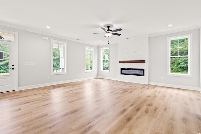 805 Comanders Island Rd, Georgetown, SC 29440 - unfurnished living room with ornamental molding, recessed lighting, light wood-style flooring, ceiling fan, and a glass covered fireplace