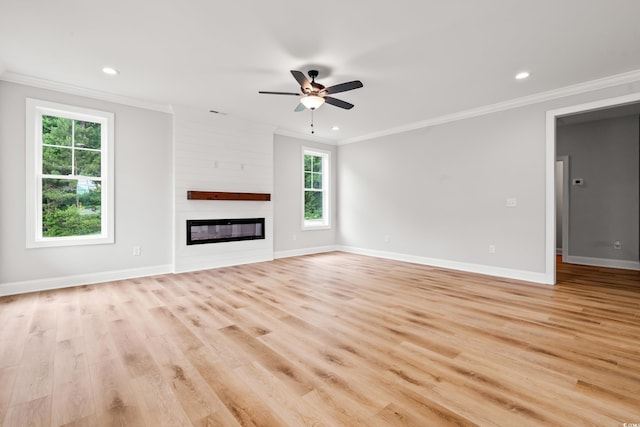 805 Comanders Island Rd, Georgetown, SC 29440 - unfurnished living room with crown molding, plenty of natural light, ceiling fan, baseboards, and light wood finished floors