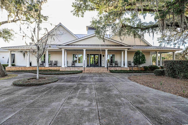 805 Comanders Island Rd, Georgetown, SC 29440 - farmhouse-style home featuring a standing seam roof, a porch, metal roof, and french doors