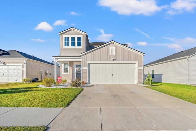 view of front of home with a garage and a front lawn