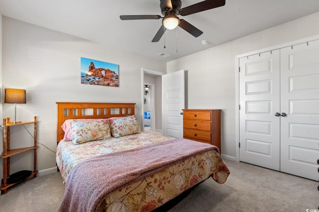 carpeted bedroom with a closet and ceiling fan