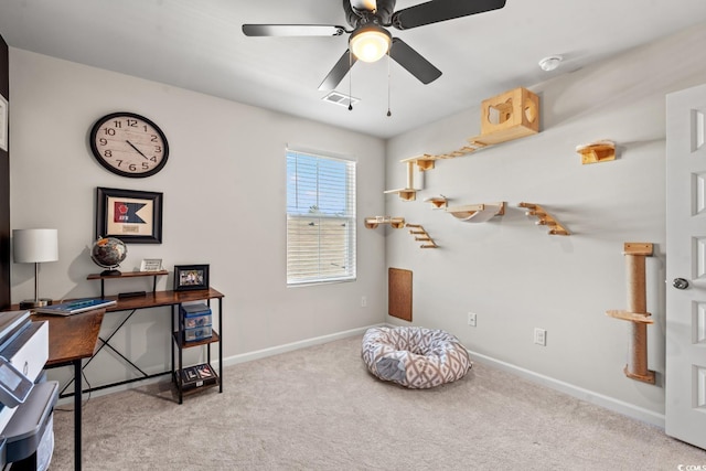 miscellaneous room featuring ceiling fan and light colored carpet