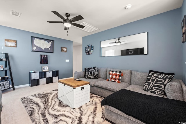 living room with ceiling fan and carpet floors