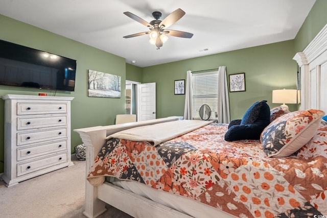 bedroom with light colored carpet and ceiling fan