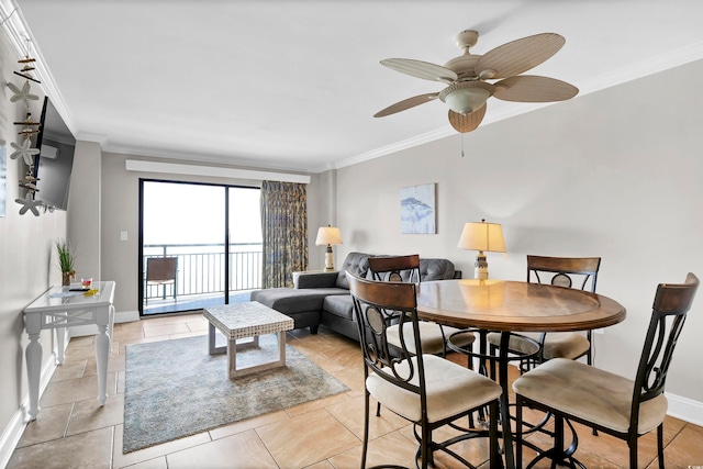 dining room featuring crown molding, ceiling fan, and light tile patterned flooring