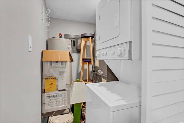 laundry area with stacked washing maching and dryer