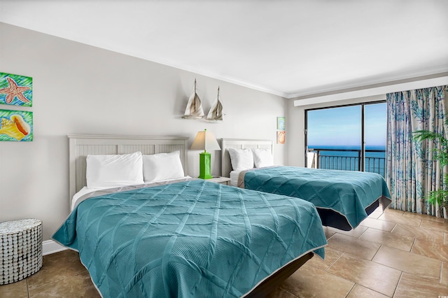 bedroom with access to exterior, a water view, and ornamental molding