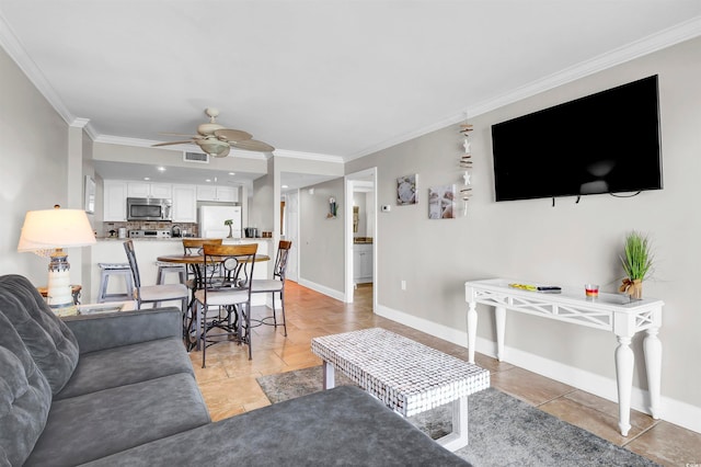 living room with ceiling fan and ornamental molding