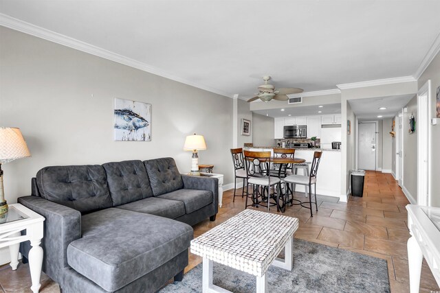 living room with ceiling fan and ornamental molding