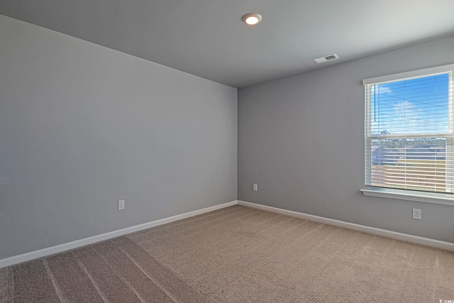 unfurnished room featuring carpet flooring