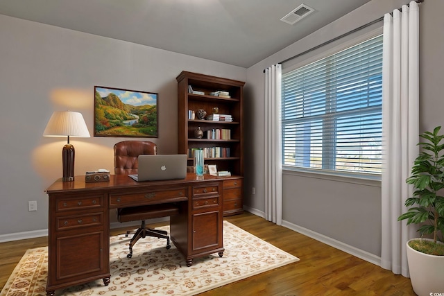 office with hardwood / wood-style floors