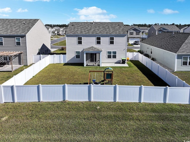 exterior space featuring a front yard and a playground