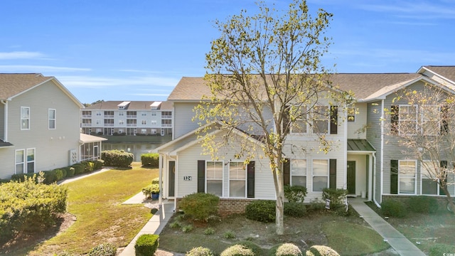 view of property with a front lawn