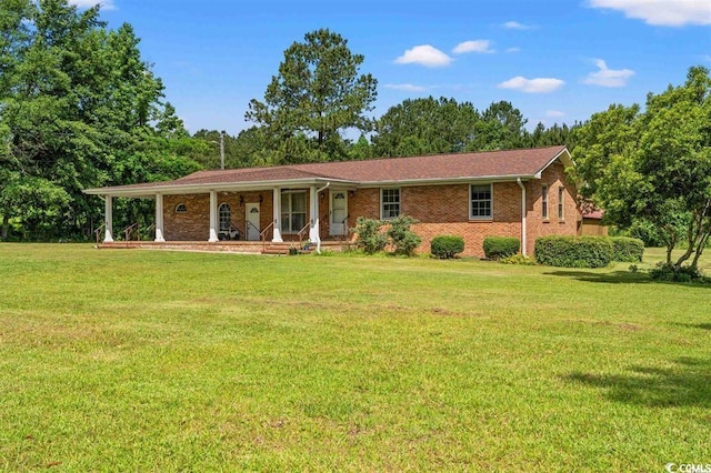 ranch-style house with a porch and a front lawn