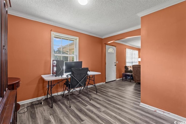 office space featuring hardwood / wood-style flooring, a textured ceiling, and a wealth of natural light