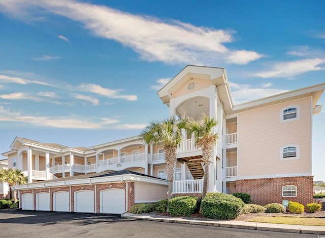 4878 Dahlia Ct Unit 24-304, Myrtle Beach, SC 29577 - view of building exterior with community garages and central air condition unit