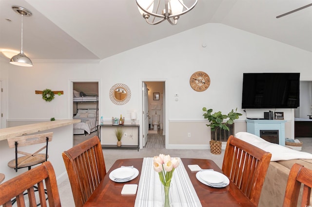 4878 Dahlia Ct Unit 24-304, Myrtle Beach, SC 29577 - dining area featuring lofted ceiling, a chandelier, carpet, baseboards, and a glass covered fireplace