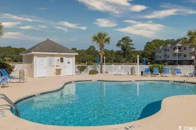 4878 Dahlia Ct Unit 24-304, Myrtle Beach, SC 29577 - community pool featuring a patio and fence
