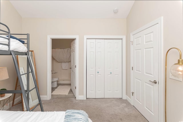 4878 Dahlia Ct Unit 24-304, Myrtle Beach, SC 29577 - bedroom with carpet flooring, baseboards, a closet, and ensuite bathroom