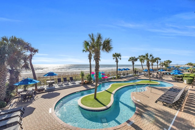 2311 S Ocean Blvd Unit 139, Myrtle Beach, SC 29577 - view of pool featuring a putting green, view of water and beach, and a patio area