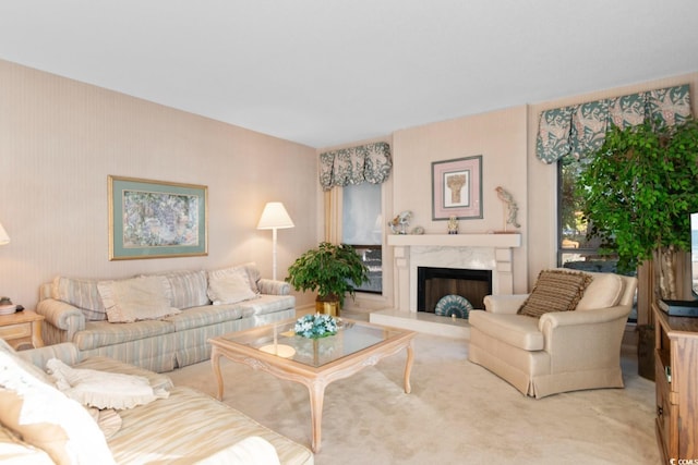 living room with a fireplace and carpet floors