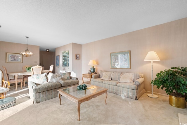 living room with light carpet and an inviting chandelier