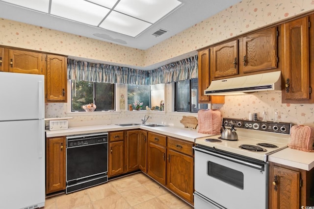 kitchen with white appliances and sink