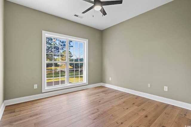 unfurnished room featuring ceiling fan and light wood-type flooring