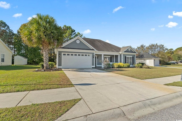 ranch-style home featuring a garage, a storage shed, and a front lawn