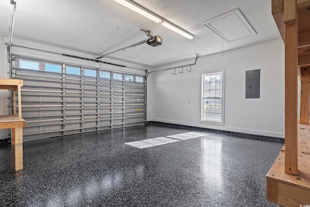 garage with electric panel and a garage door opener